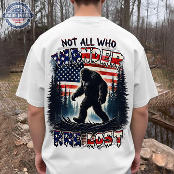 Not All Who Wander Are Lost T-Shirt – Patriotic Bigfoot American Flag Graphic Shirt for Outdoor, Hiking & USA Adventure Lovers