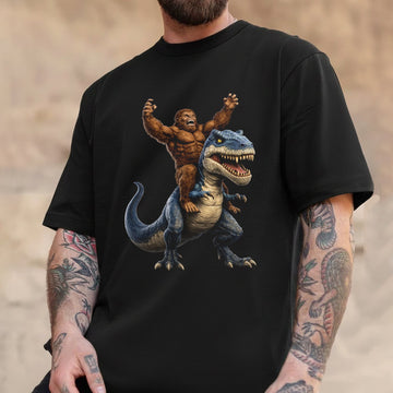Bigfoot Riding Dinosaur T-Shirt – Funny Sasquatch on T-Rex Graphic Tee, Epic Fantasy Humor Shirt for Adventure & Meme Lovers