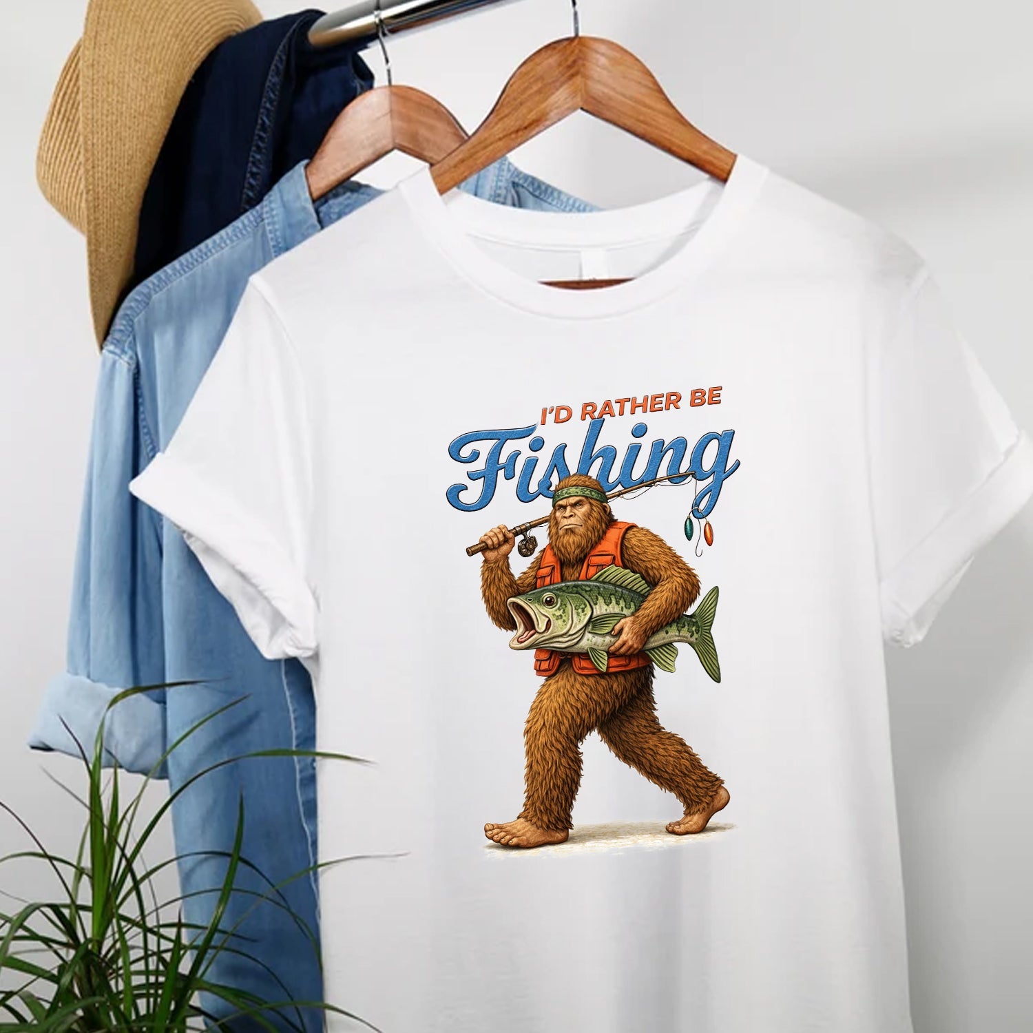 I’d Rather Be Fishing Bigfoot T-Shirt, Sasquatch Fisherman Graphic Tee, Funny Fishing Outdoor Nature Shirt